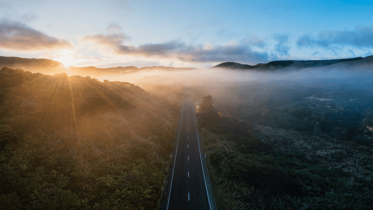 foggy road and mountain